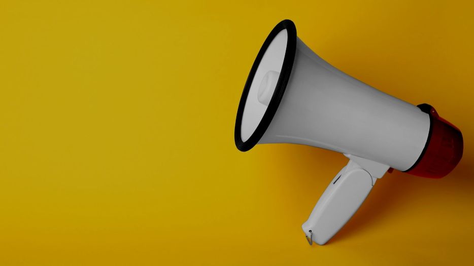 megaphone with a yellow background